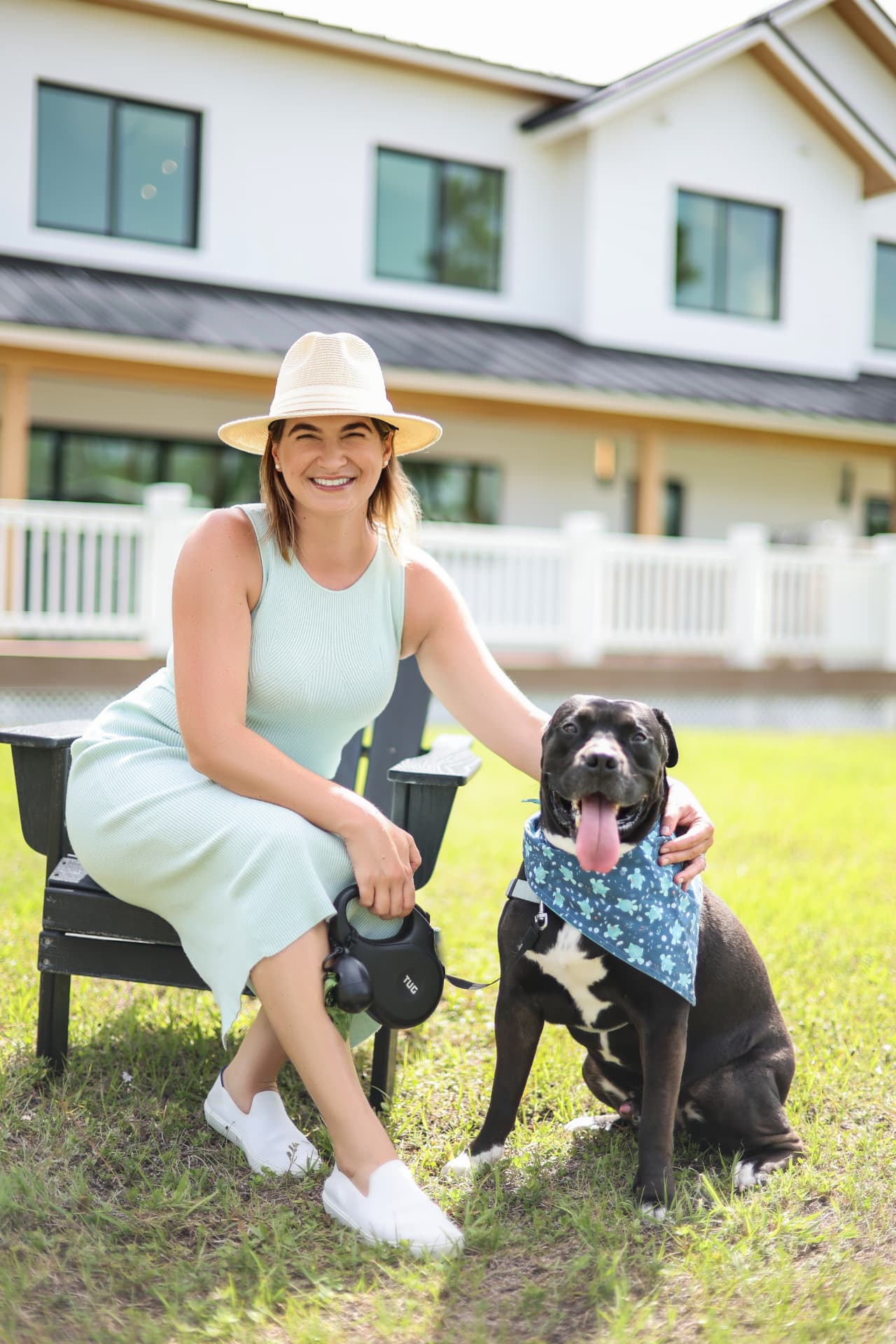 Olivia Bardinelli with a rescue dog outside a South Florida home
